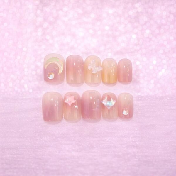 أظافر لاصقة فاخرة بتدرج وردي مع لمسات لؤلؤية